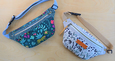 two hip pouches with two different fabric patterns