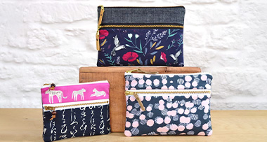 three double zipper pouches showcasing the different sizes Kandou Patterns offers