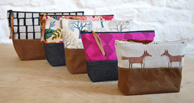 five zipper pouches created by Kandou Patterns to advertise this bag pattern